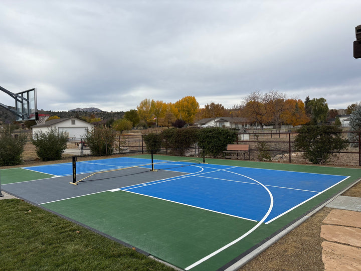 Outdoor modular basketball and pickleball court.